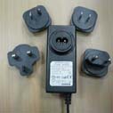 Switching Power Adapter With Exchangeable Plugs